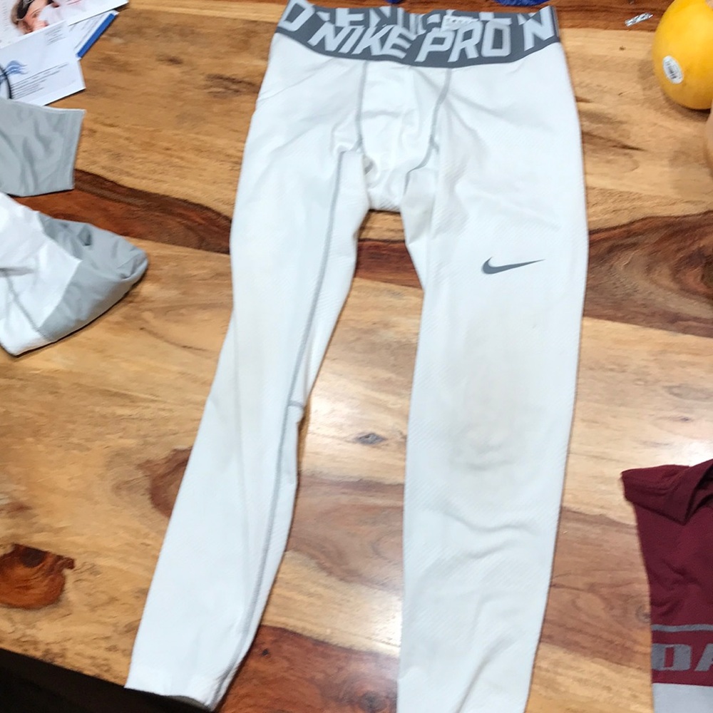 Nike Pro and Nike Combat white leggings.